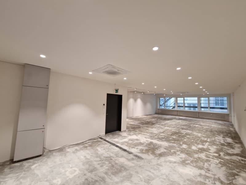 empty room, white walls, concrete floor, air conditioning unit, door, window