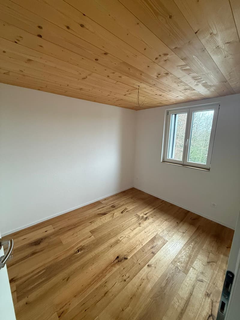 wooden ceiling, hardwood floor, small window, no furniture