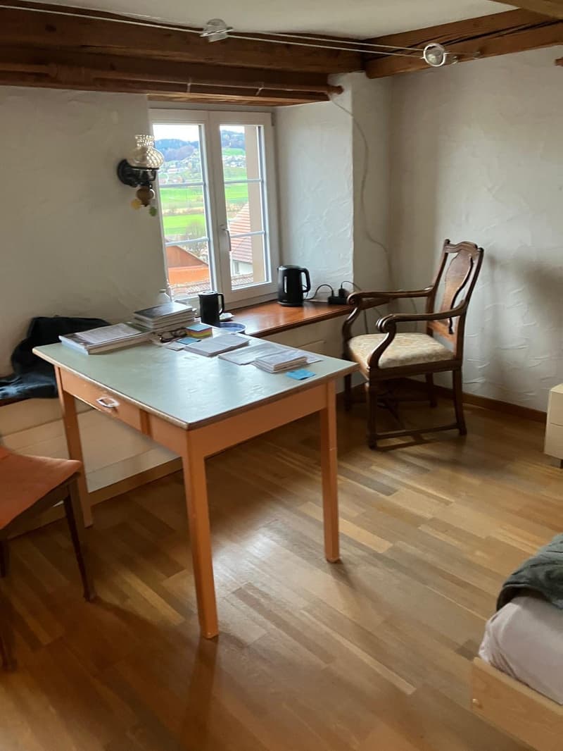 desk, chair, bed, window, wall lamp, kettle, wooden floor