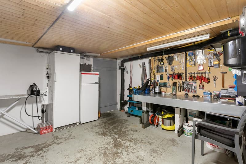 wooden ceiling, metal workbench, tools, white refrigerator, Coca Cola cooler, metal chair, work basket