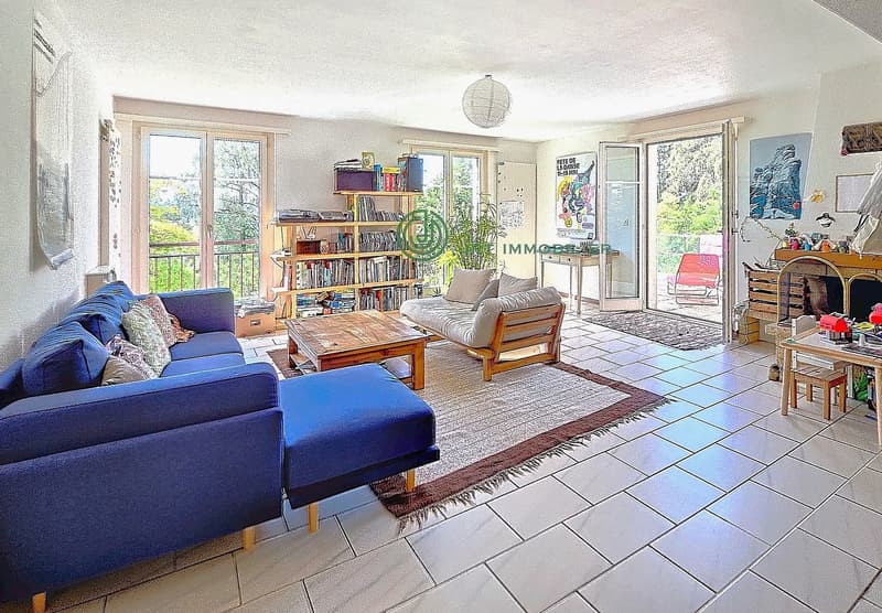 tiled floor, blue sofa, coffee table, bookshelf, fireplace, balcony