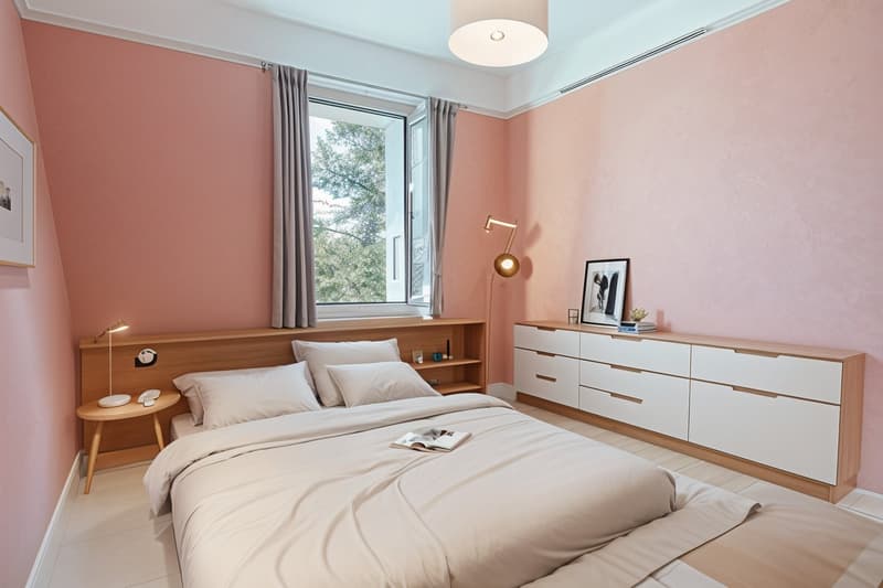 Bedroom with pink walls, wooden bed, white bedding, nightstand with lamp, wooden cabinet with drawers, picture frame, open window with curtains, ceiling lamp, book on bed.