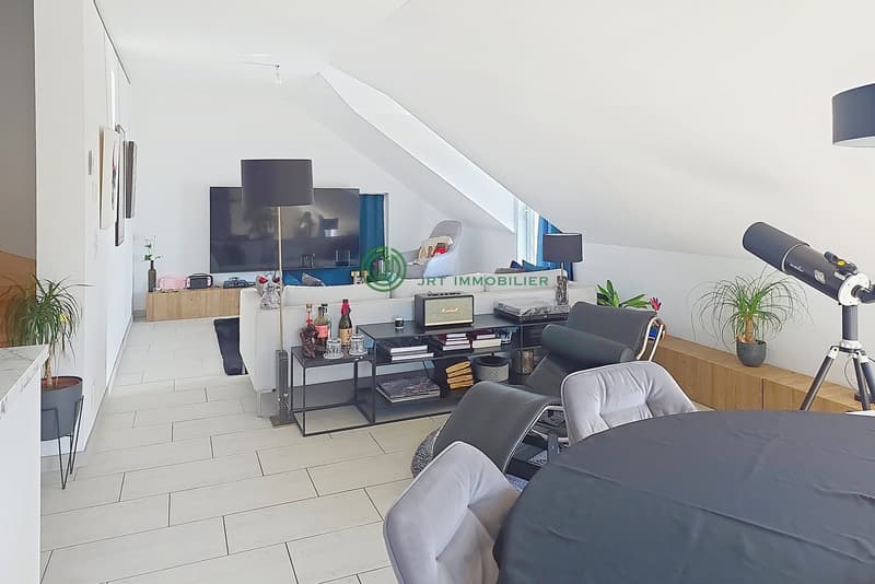 modern living room with white tiles, white walls, large windows, white sofa, TV, coffee table, side table, floor lamp, potted plants, telescope