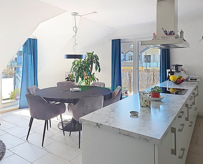 modern kitchen with dining area, marble countertop, large windows, balcony, dining table, chairs, plant, modern appliances