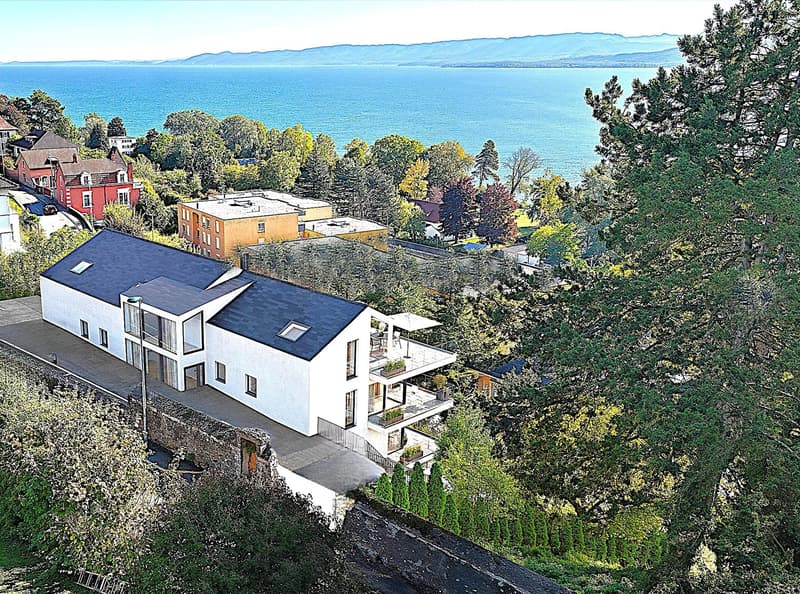 Modern white house with multiple balconies, located on a hill with a view of the sea
