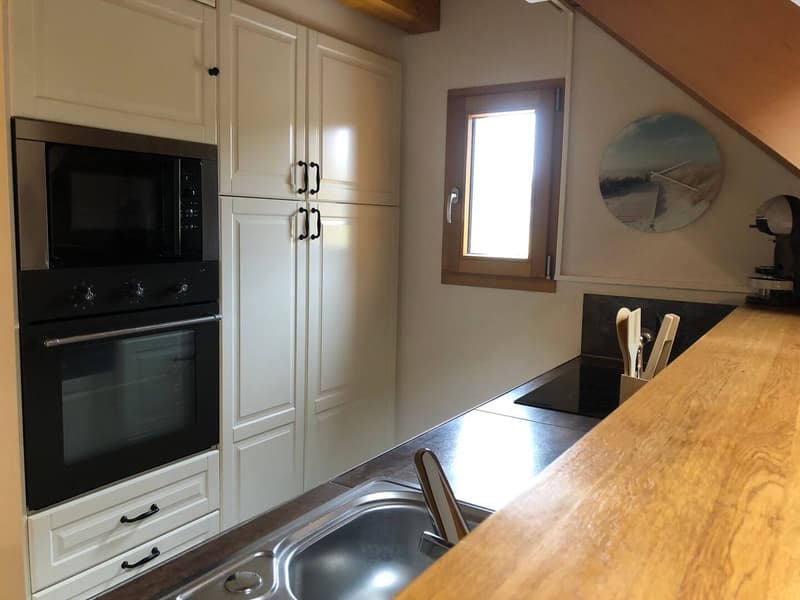 modern kitchen, stainless steel appliances, wooden cabinets, tiled floor, open shelves, black oven, wooden countertop, white sink