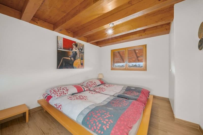 wooden floor, white walls, twin beds, nightstand, wall painting, ceiling lamp, window