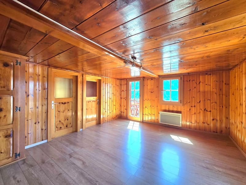 wooden walls, wooden floor, two doors, two windows, balcony