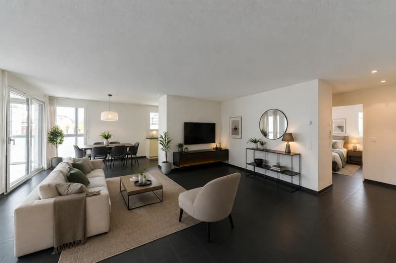 / a large living room with black floors and white furniture and a black table and chairs