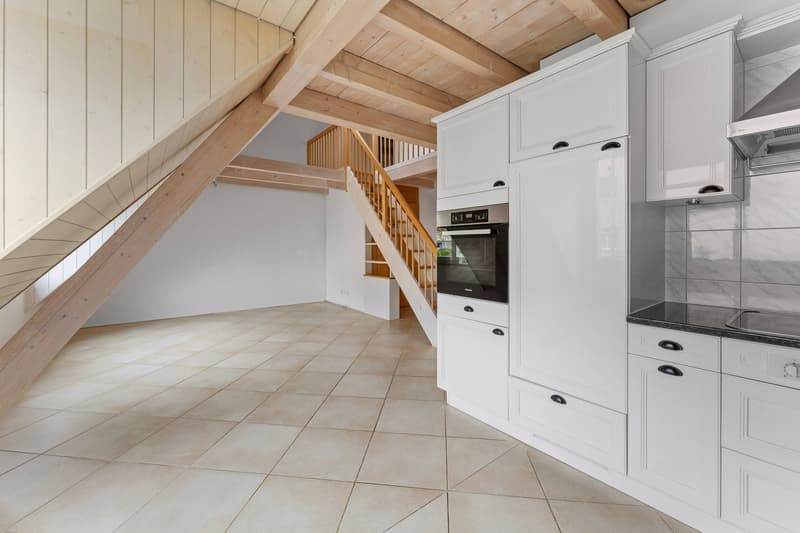 kitchen with white cabinets, tiled floor, wooden beams, oven, sink, staircase