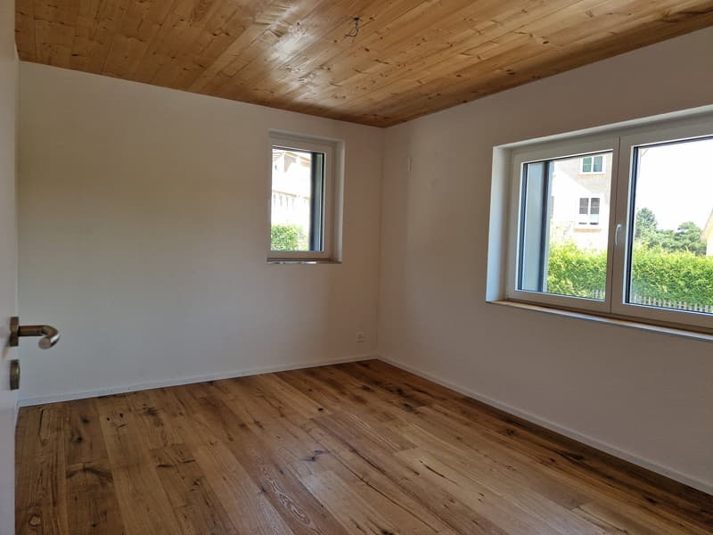 empty room, wooden floor, white walls, two windows, wooden ceiling