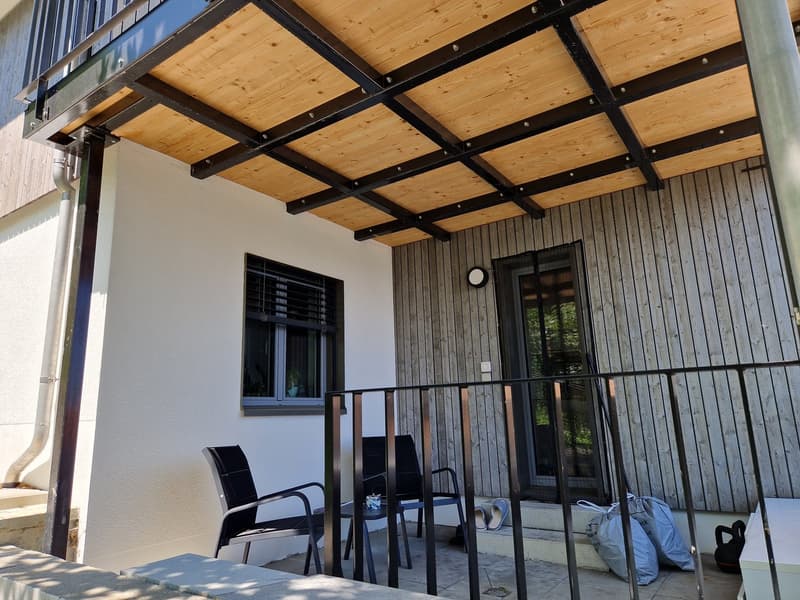 wooden ceiling, black railings, white walls, black chairs, glass door, window with blinds