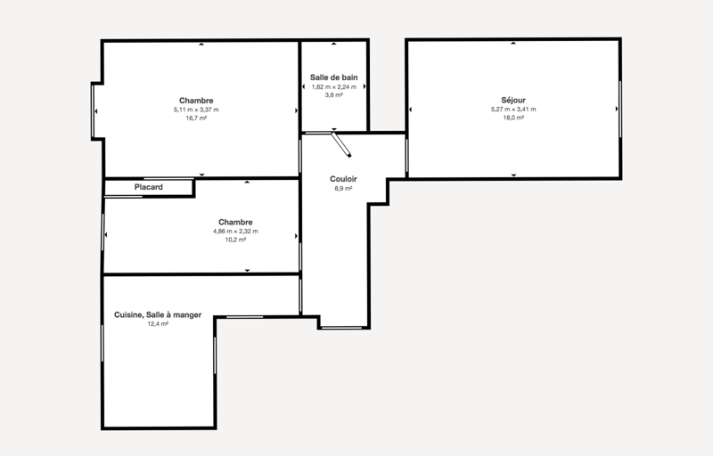 A two-room floor plan consisting of a bedroom, bathroom, and kitchen with a dining area.