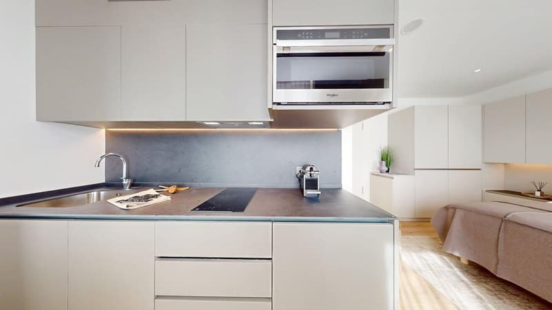 white cabinets, modern kitchen, sink, stove, microwave, countertop, carpet