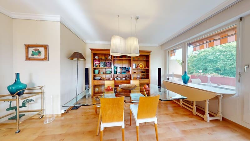 Glass table, wooden chairs, wooden bookshelf, picture frame, blue vases, white table
