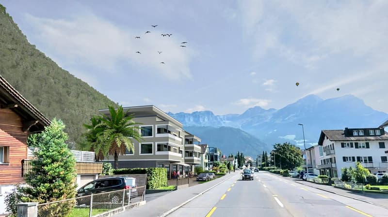 new building with many floors, modern architecture, mountain in background, road with parked cars