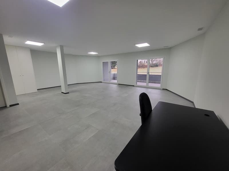 empty room, tile floor, white walls, doors, windows, balcony, black desk