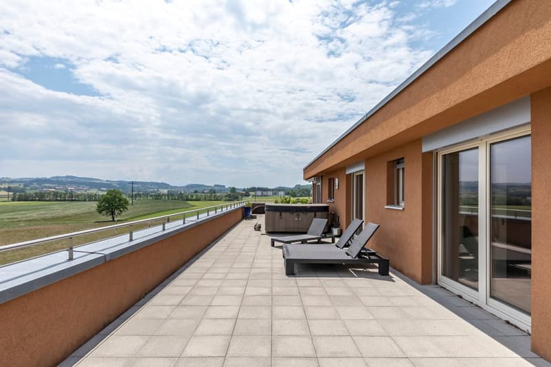 sun loungers, hot tub, view over green field