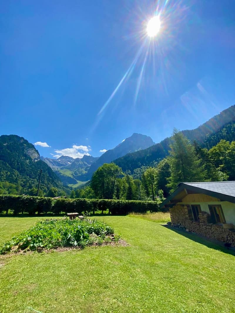 a sunny day with mountains in the background