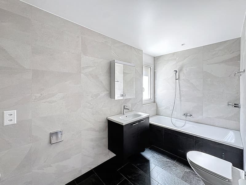 Appartamento in sottotetto di 4.5 locali con grande balcone/terrazza (10)