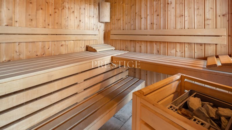 wooden sauna with benches, wooden walls, wooden box with rocks