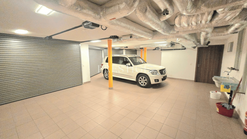 tiled floor, white SUV, washbasin, broom, fire extinguisher