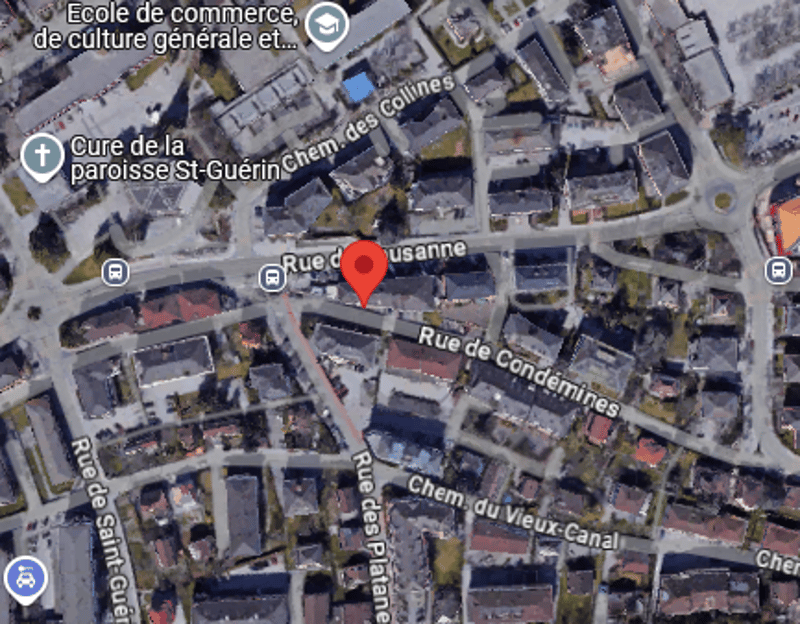 This image appears to be a satellite map view of a town or city. It shows a grid-like street layout with various buildings and structures. The streets are labeled in French, indicating this is likely a location in France.