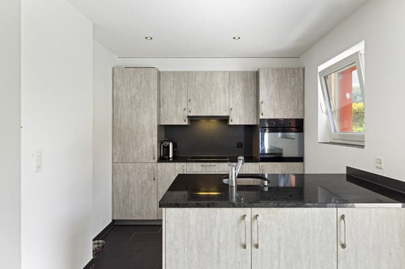 Spacieux 3 pièces 1/2 en rez-de-jardin de 107 m² (5)