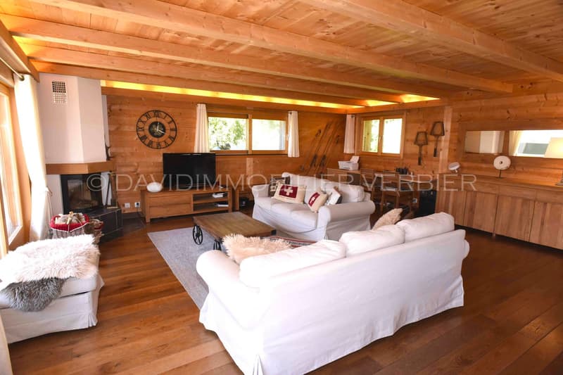 wooden floor, large living room, white sofa, center table, TV, fireplace, wooden shelf, clock