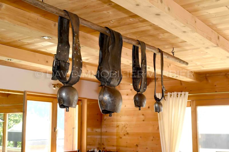 Wooden ceiling, decorative metal bells, wooden walls, natural light