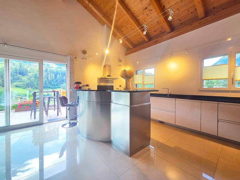 Kitchen island, large sliding glass door, natural light, mountain view, modern decor