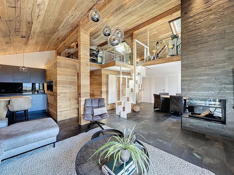 modern open-plan living, kitchen and dining room with large fireplace, wooden ceiling and floor, central island, comfortable seating area