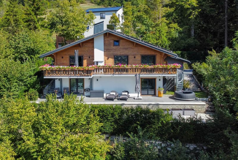 detached house, wooden exterior, balcony with flower boxes, outdoor pool, outdoor seating, garden