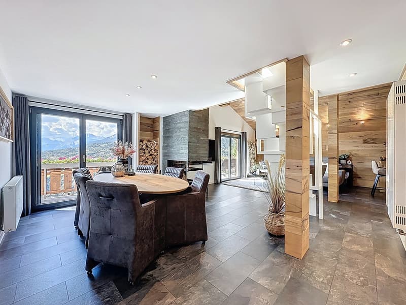 round table, wooden and leather chairs, large glass windows, wooden floors, fireplace, potted plants, balcony, modern interior