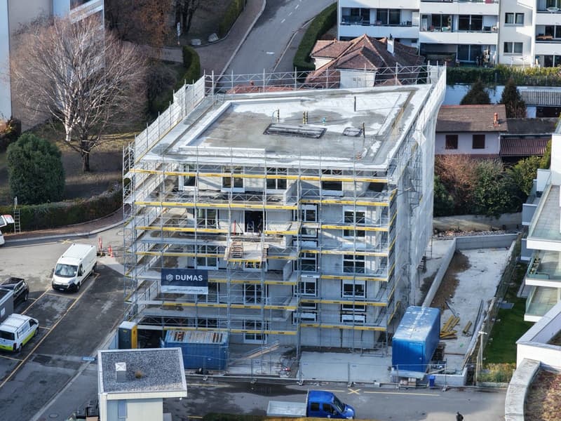 Under construction building, scaffolding, multiple floors, industrial equipment
