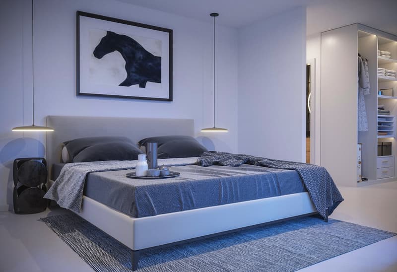 A modern, minimalist bedroom featuring a bed, a gray rug, an open wardrobe, and artwork on the wall