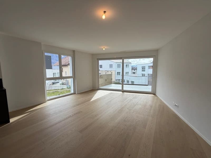 empty room, wooden floor, white walls, large windows, sliding glass doors, balcony