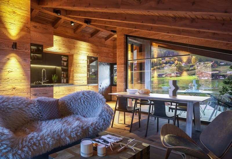 Open concept living room, dining area, cozy seating, wooden beams, large glass windows, scenic view, wooden floor.