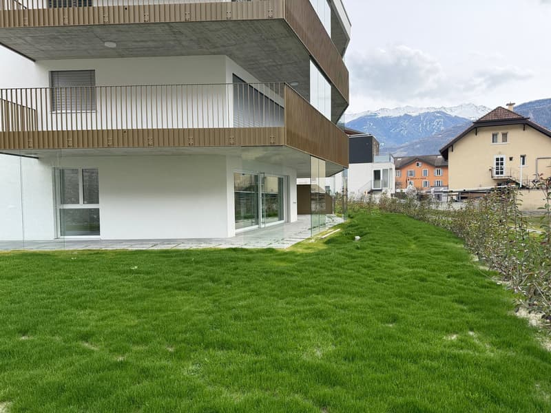 modern design, white exterior, glass walls, balcony, green lawn, mountain view