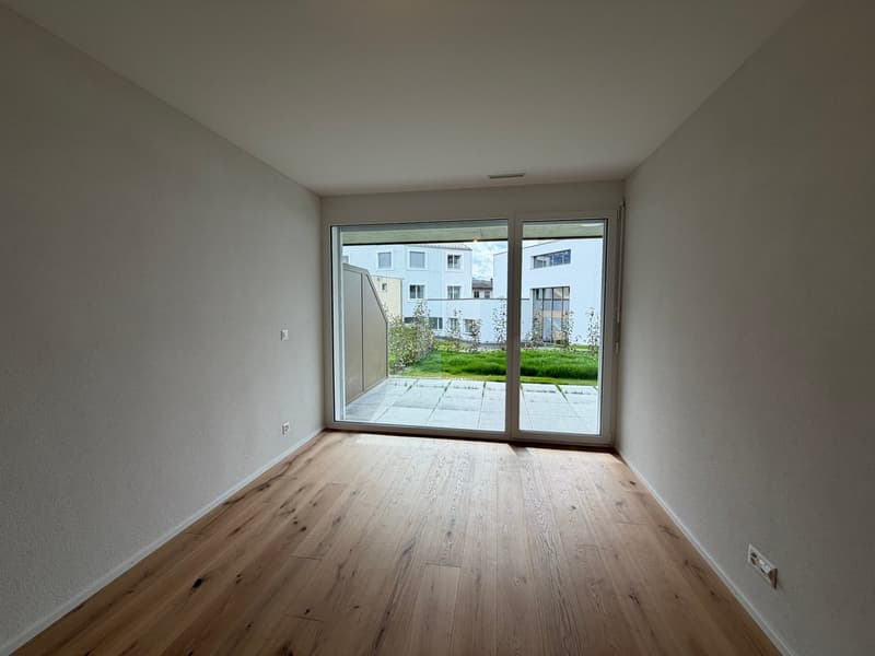empty room, wooden floor, white walls, sliding glass door, balcony