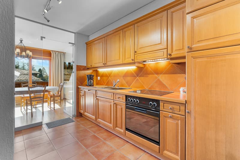 / a large kitchen and dining room in a modern home