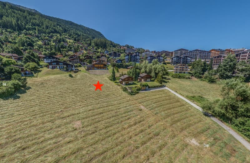 Plot of land with mountain view, highlighted by red star