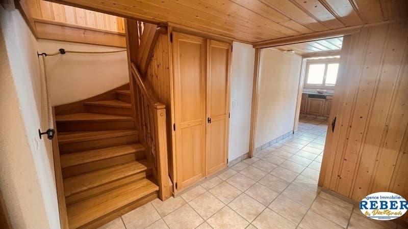 wooden staircase, wooden doors, tiled floor, wooden ceiling