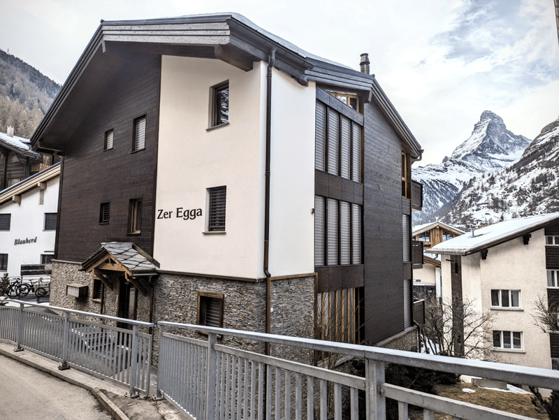 Stone and wood building, balconies, modern architecture, mountain view