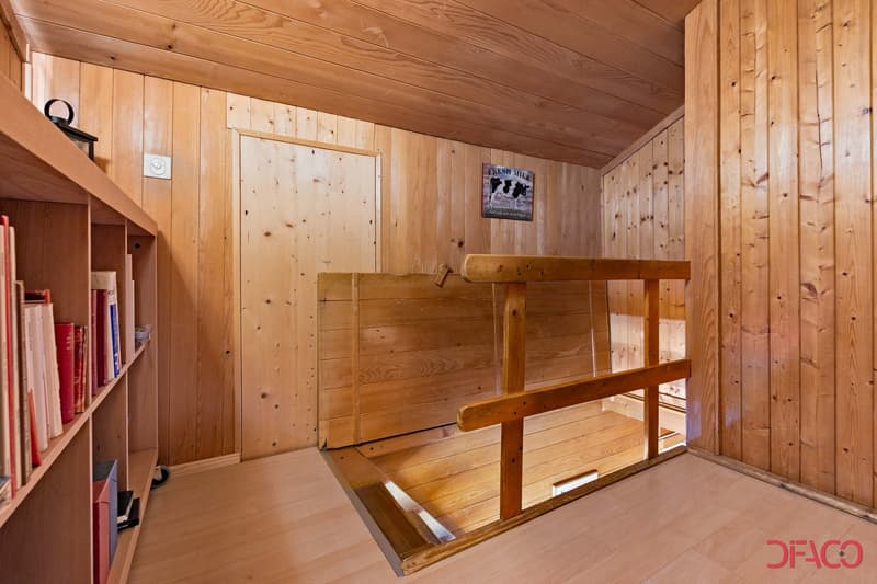Wooden interior with shelves, wooden bench, and a 'Fresh Milk' sign on the wall