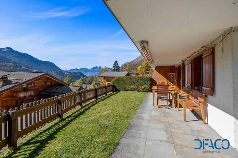 patio, wooden fence, table and chairs, balcony, green lawn, mountain view