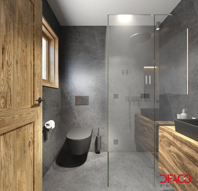 Gray walls and floor, glass walk-in shower, wooden window frames, black toilet and sink, wooden vanity, roll of toilet paper, a bottle of hand soap