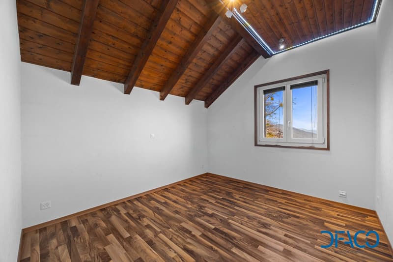 wooden floor, wooden ceiling, white walls, window with view, power outlets