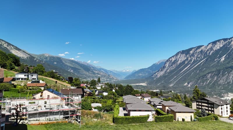 hillside houses, mountains, sky