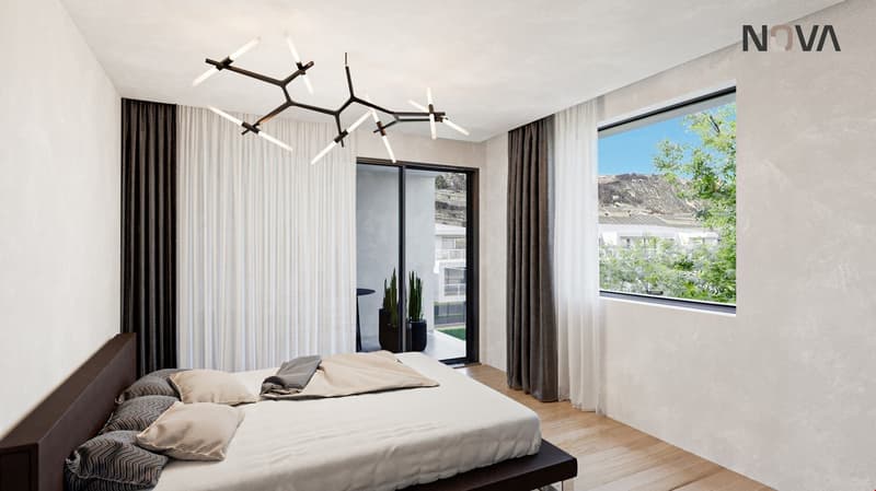 Contemporary bedroom with white walls, wooden floor, a large bed, sliding glass doors, and a view of the outdoors.